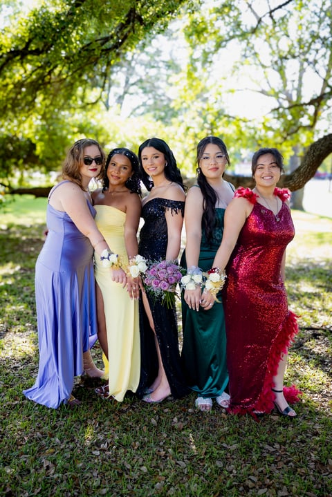 Group of friends in prom dresses